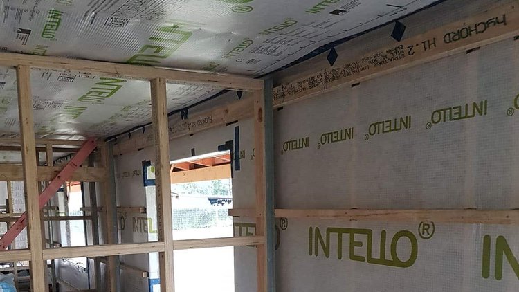 The Gibbon Passive House North Canterbury - Installed panels with airtightness INTELLO<sup>®</sup> layer on walls and roof