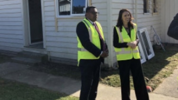 Prime Minister Jacinda Ardern and Associate Housing Minister Kris Faafoi look on during a visit to a Kainga Ora state house retrofit  in Wellington