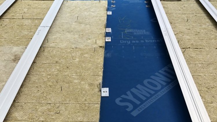 HomeGround Building  - Applying SOLITEX EXTASANA <sup>®</sup>  ADHERO to CLT Panel