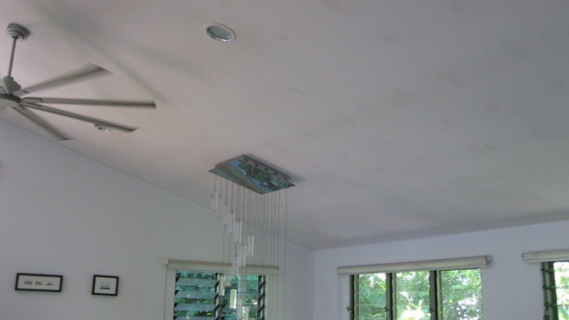 Mould growth on ceiling in Cairns from humid air reaching the back surface of the cooled plasterboard ceiling.