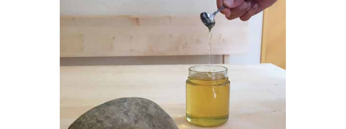 Adhesion and cohesion can be demonstrated very well by comparing runny honey with a stone.