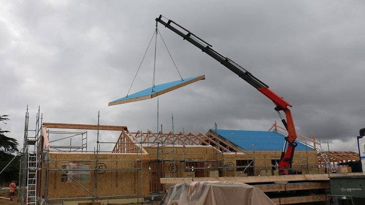 Raglan House - Crane installation of the roof