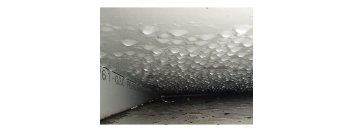 Water from the pools evaporates, travels up by air leaks to the parapet, where it condenses into the “rain”.