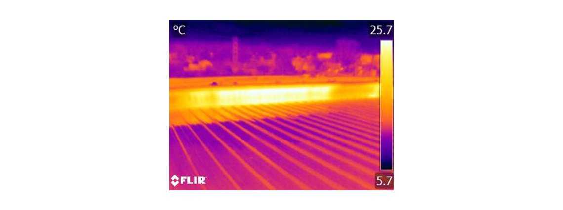 The air leaks warm the parapet and make it light up in infrared like a road sign.